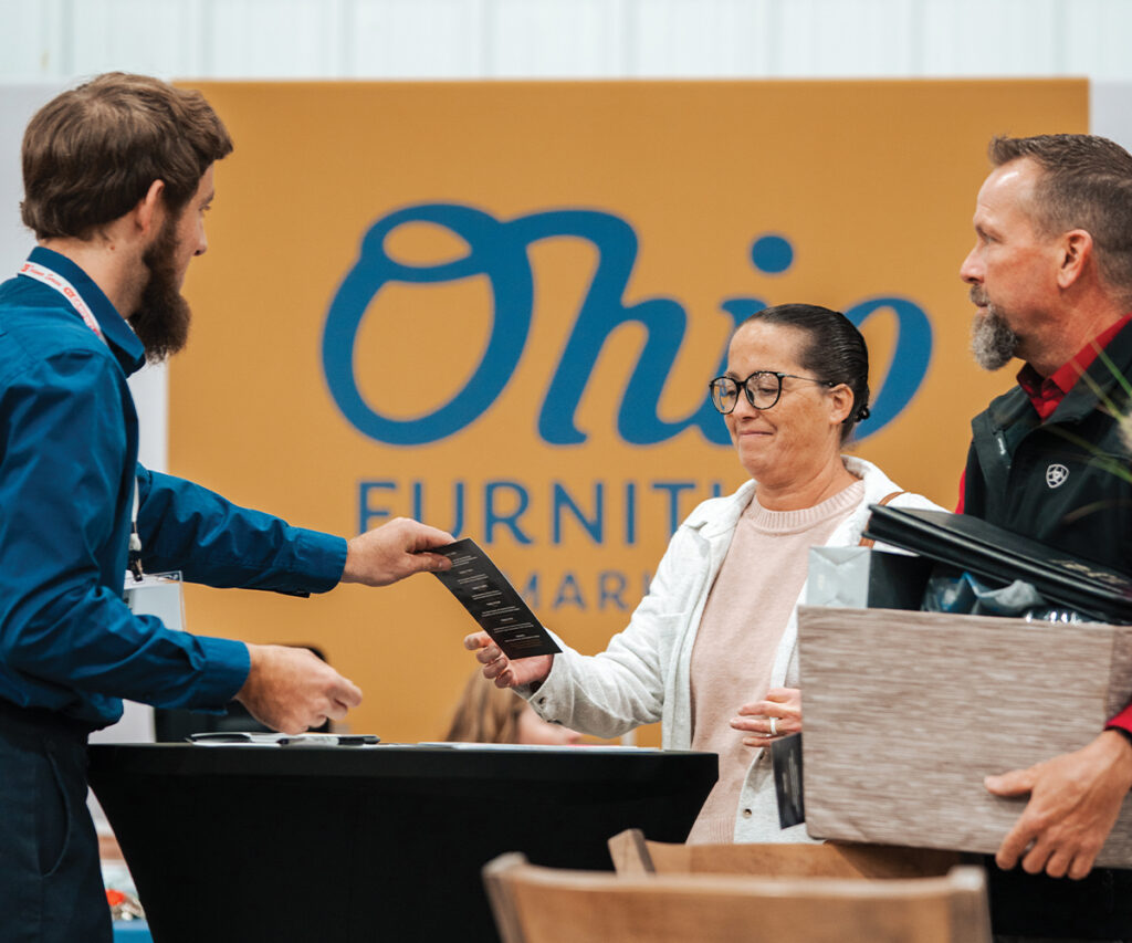 Ohio Furniture Market page with attendee check-in photo and event details.